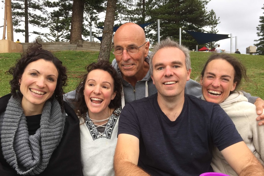 Rory O'Donoghue with his four adult children — three women and one man, all smiling