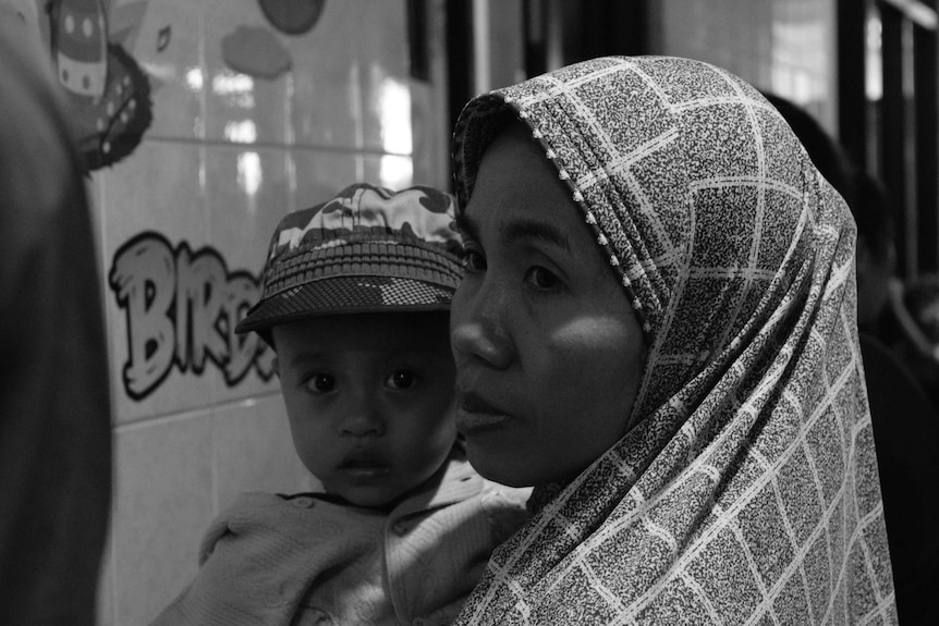 Women with child in medical clinic