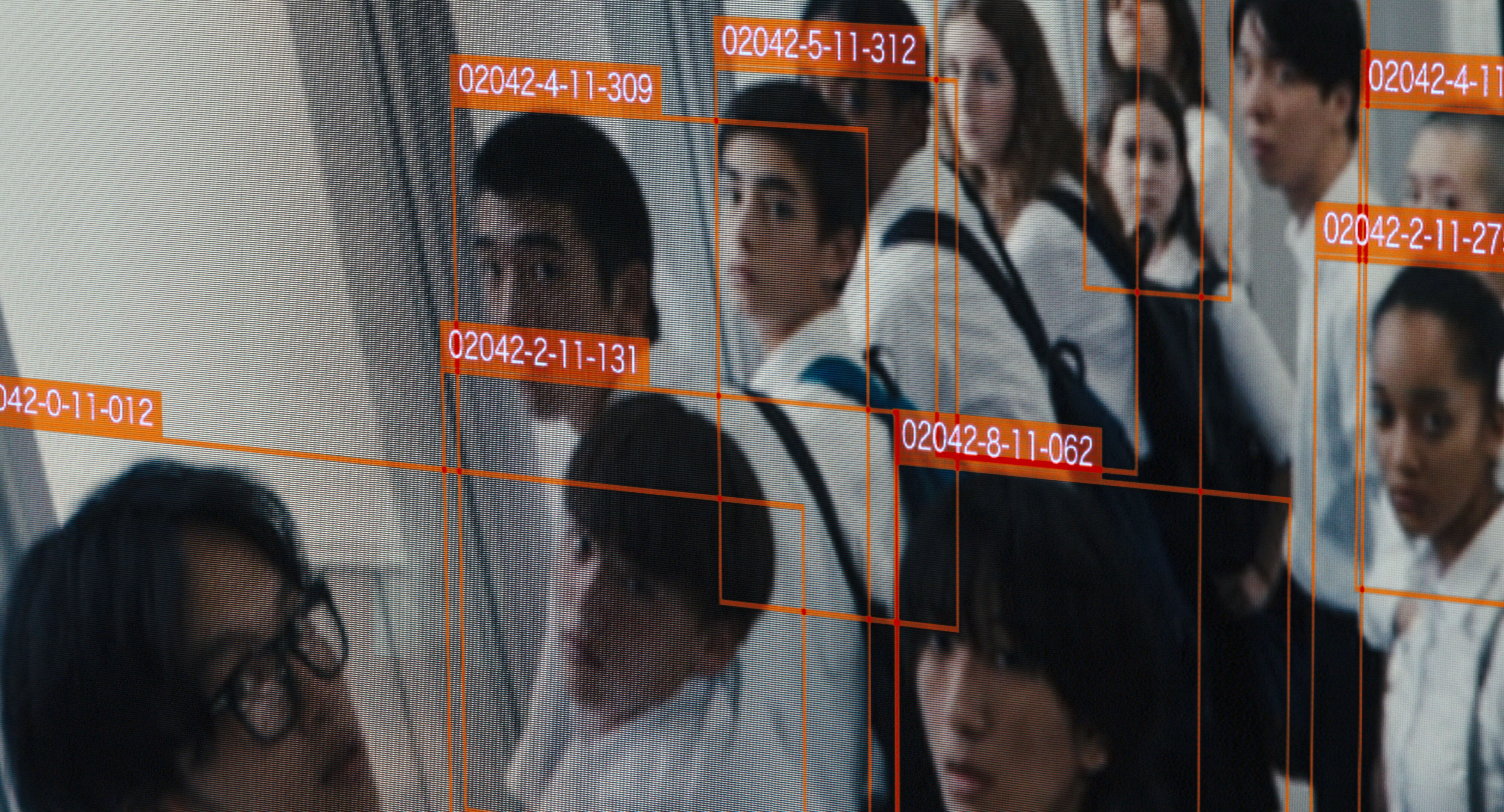 A screngrab from the film Happyend showing high schoolers identidfied through the lens of facial recognition technology 