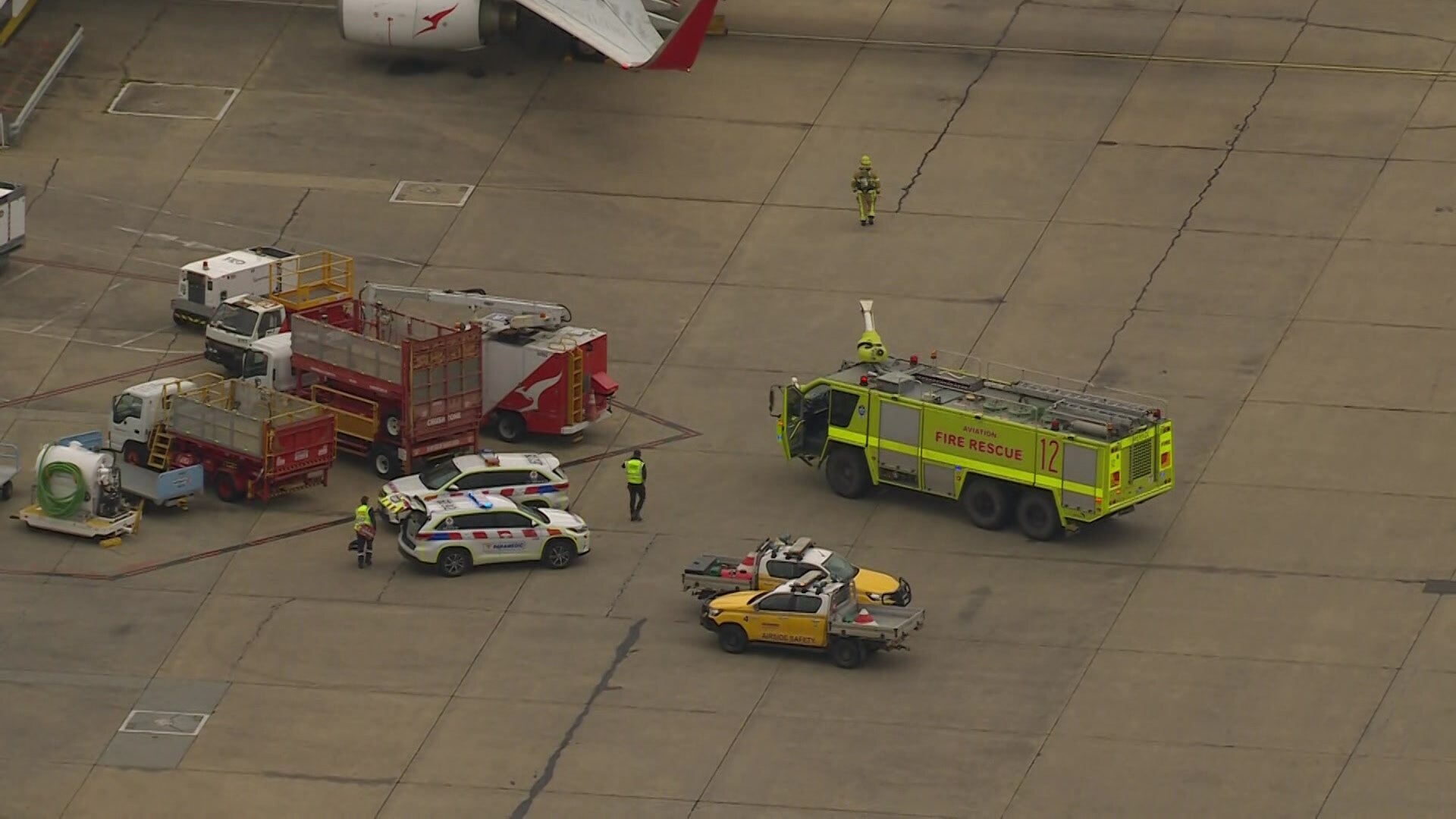 fire response vehicles on the airport tarmac.