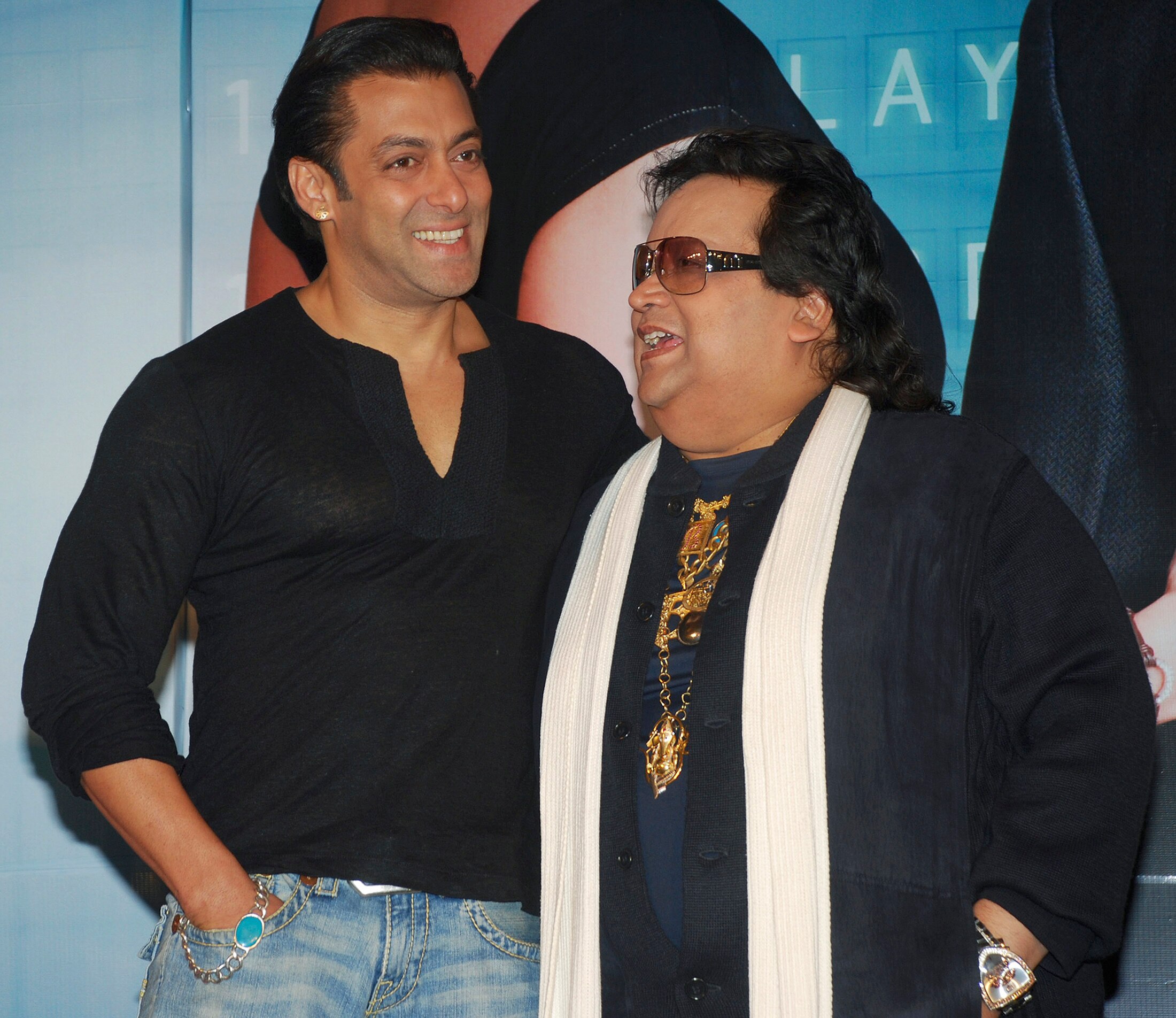 A picture of Bappi Lahiri standing next to another man 