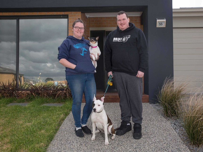 Emily and Ashly Blair at the front of their home.