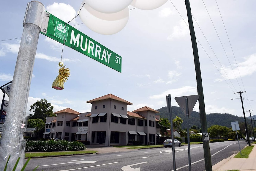 Balloons tied on the Murray Street sign in the Cairns suburb of Manoora,