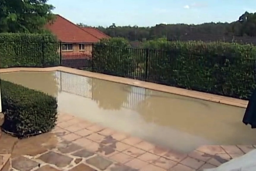 A swimming pool with dirty water