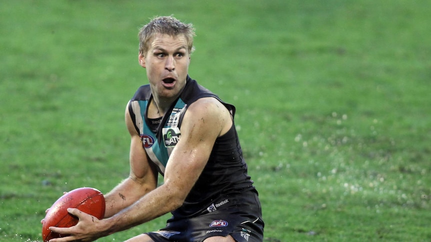 Not sacked... Kane Cornes is still wanted by Port
