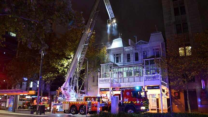 Firefighters tackle a blaze on King William Street.