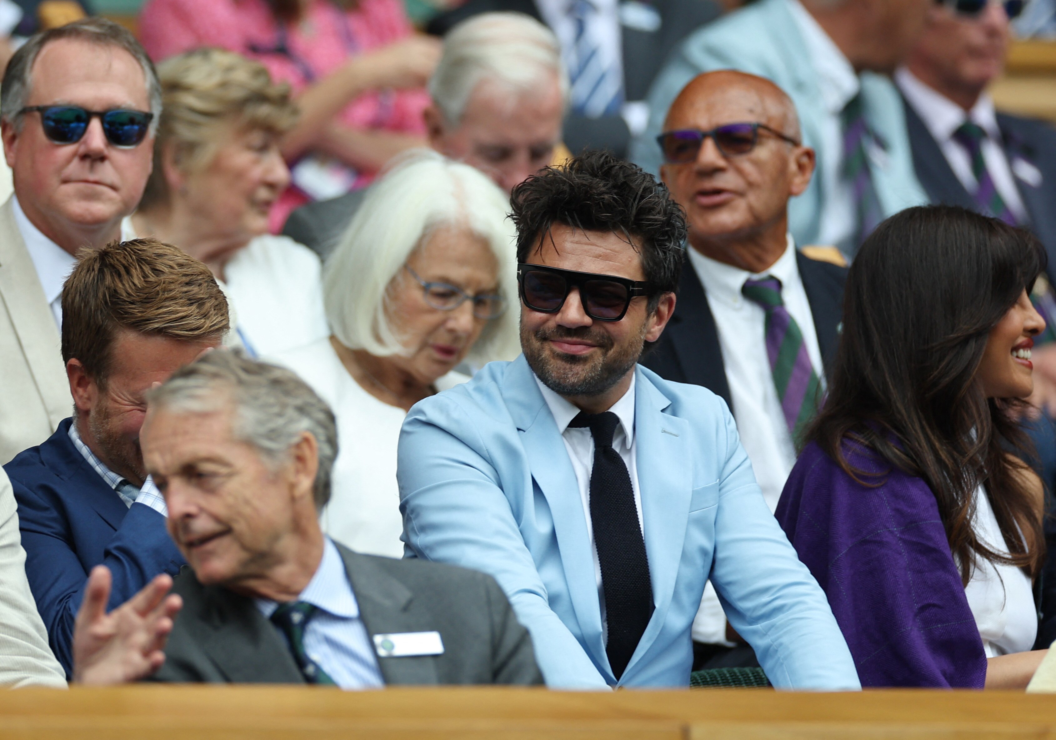 Dominic cooper in a powder blue suit and black tie
