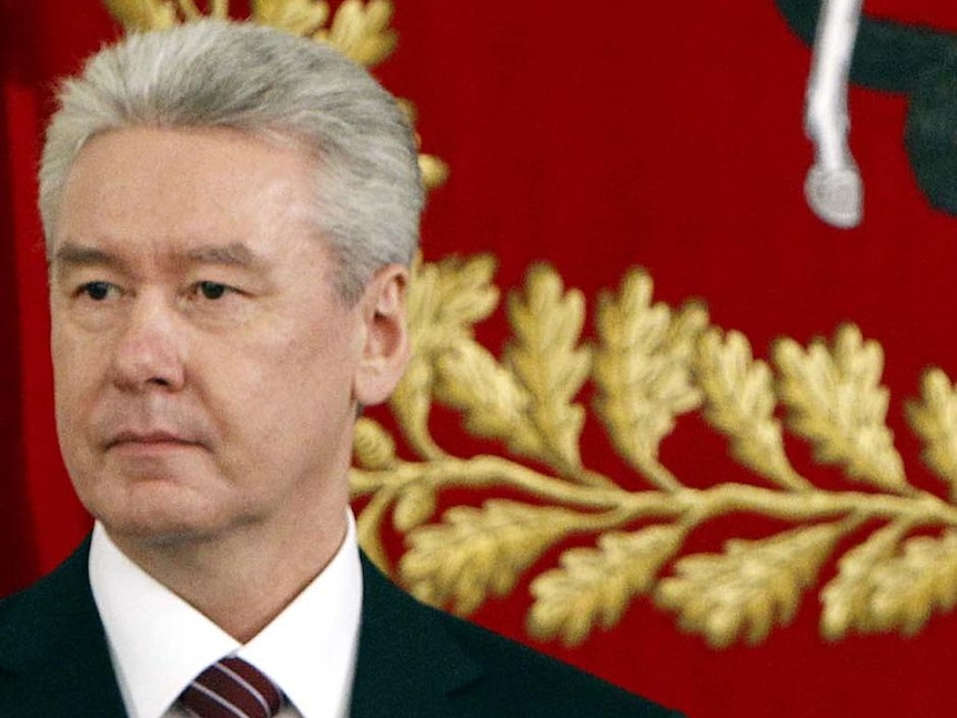 Close-up of Mr Sobyanin wearing a suit and looking to his side with a solemn expression.