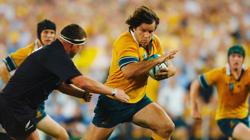 Australia's Brendan Cannon runs the ball during the 1st Rugby World Cup semi final between Australia and New Zealand.