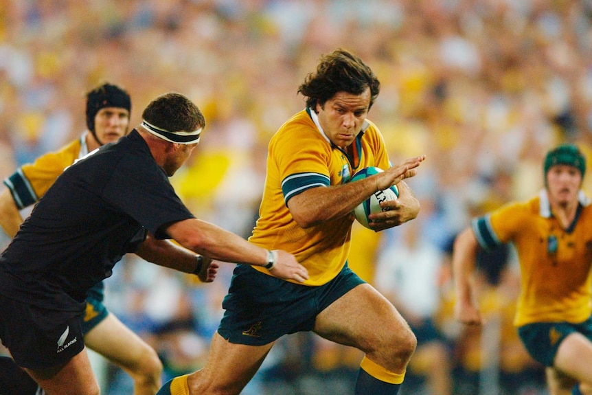 Australia's Brendan Cannon runs the ball during the 1st Rugby World Cup semi final between Australia and New Zealand.