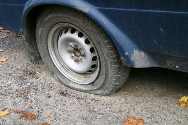 A flat tyre on a car