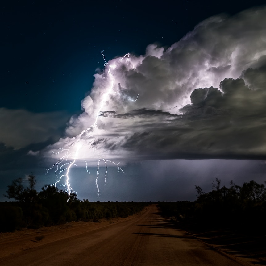 Lightning forks through a cloud.