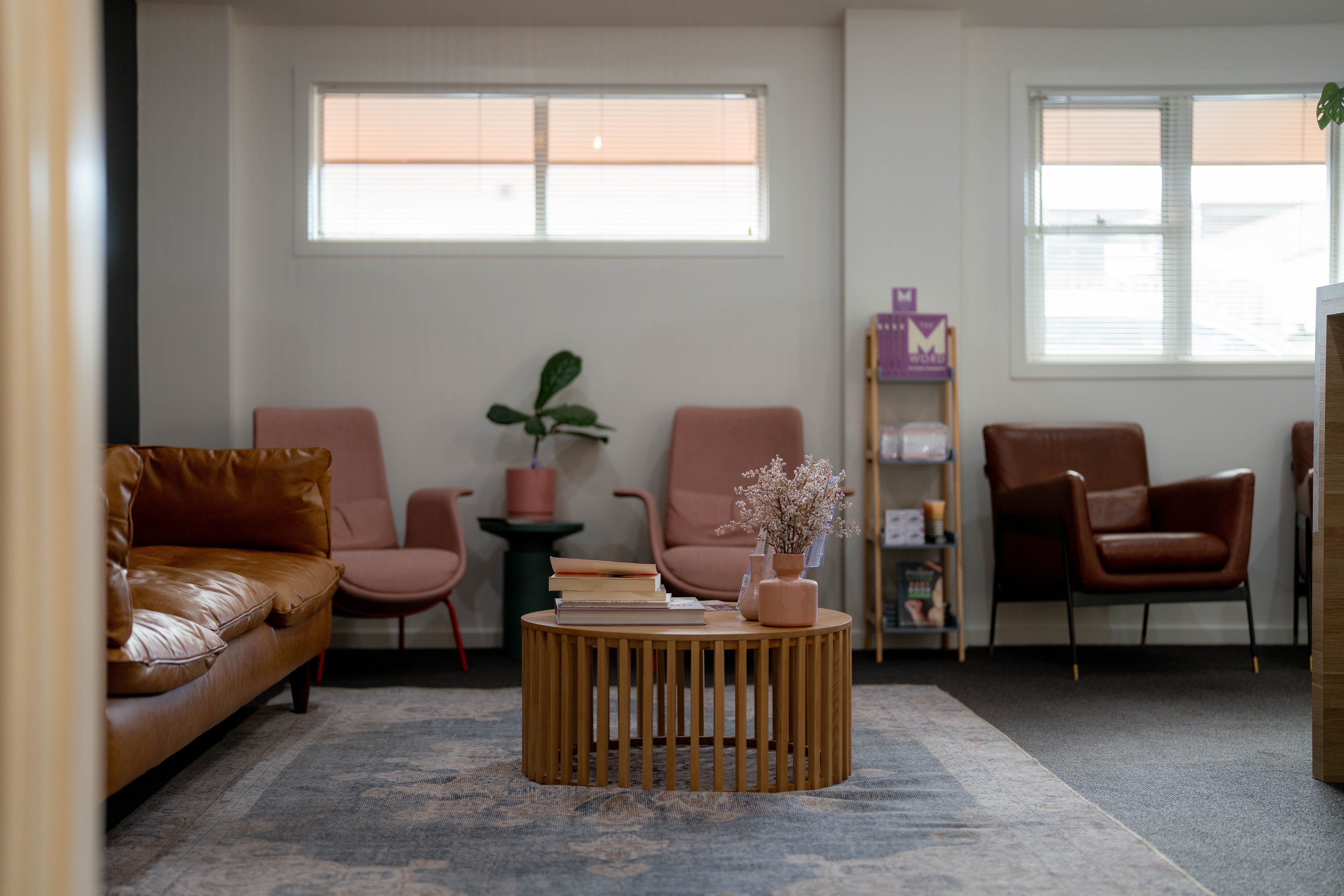GP waiting room with pink chairs