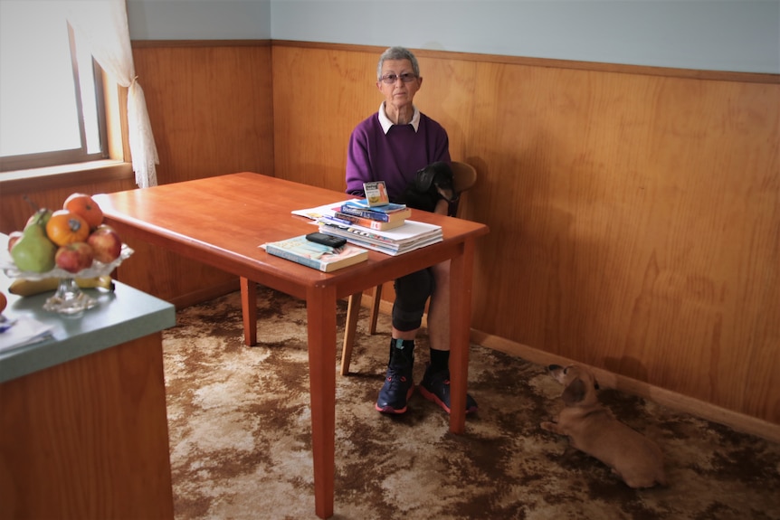 A woman sitting at a table.