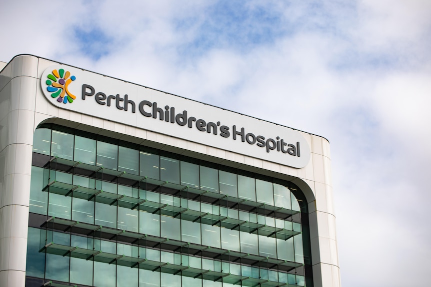 A photo of a building with a colourful logo and the words Perth Children's Hospital on the top.
