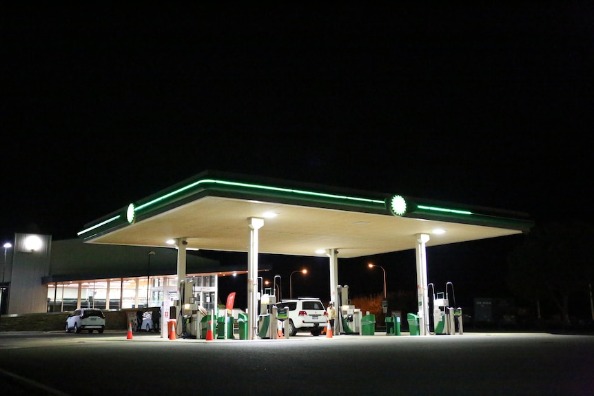 A petrol station pictured in darkness
