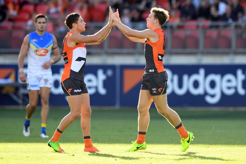 Toby Greene congratulated after kicking goal for GWS