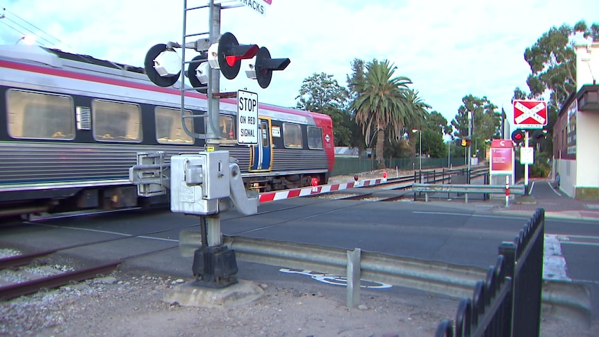 A train going through a level crossing