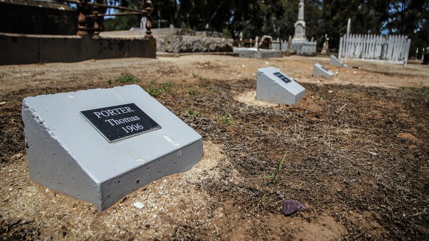 The new concrete cement markers with plaques at the Moama Cemetery.