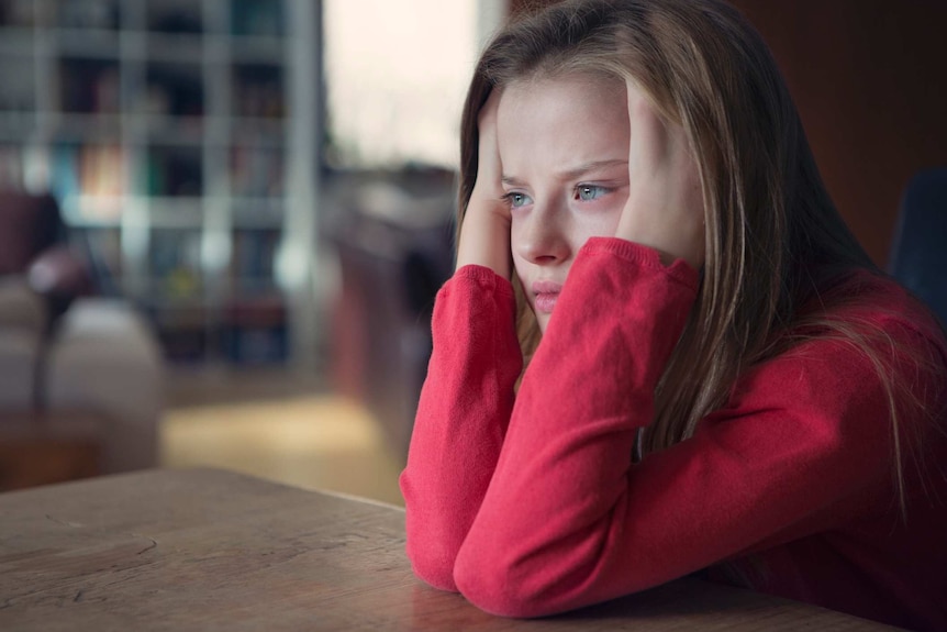 girl sitting at a table