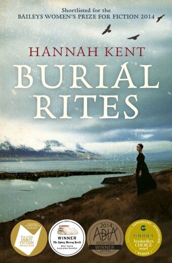 The book cover of Burial Rites by Hannah Kent, a young woman standing on the edge of an ocean