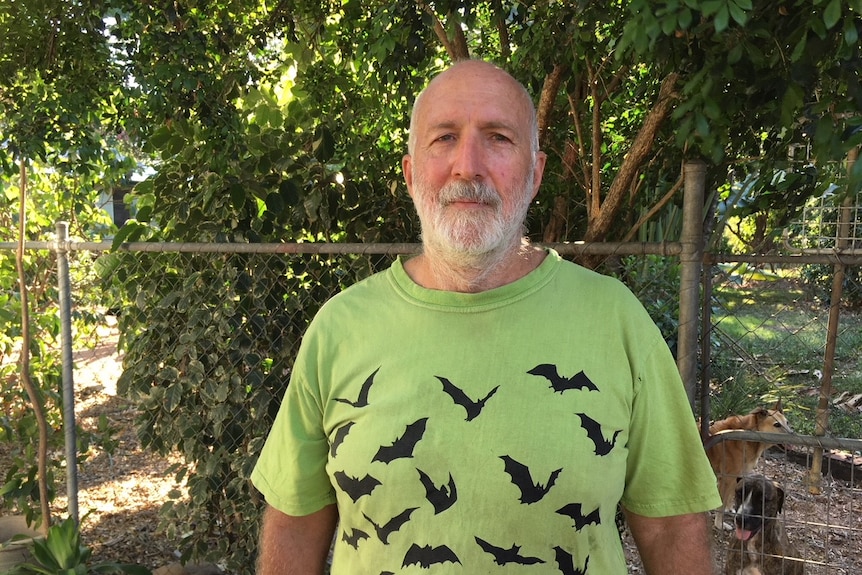 A portrait of Dr Jon Luly in a bat t-shirt.