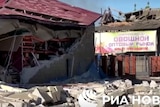 An image of a building damaged from shelling