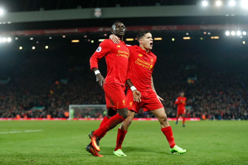 Sadio Mane and Phillipe Coutinho celebrate a Liverpool goal