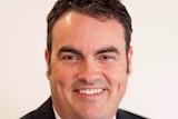 Smiling headshot of Jason Costigan, the LNP Member foir Whitsunday in north Queensland.