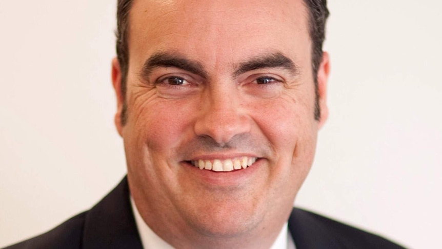 Smiling headshot of Jason Costigan, the LNP Member foir Whitsunday in north Queensland.