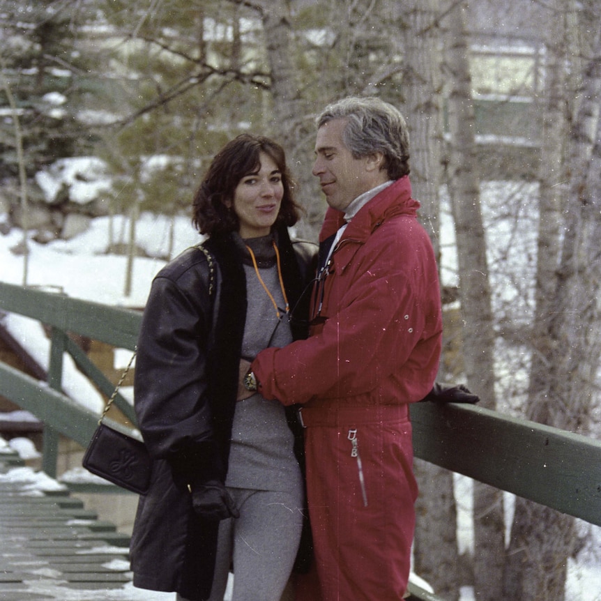 Jeffrey Epstein in a red ski suit embraces Ghislaine Maxwell 