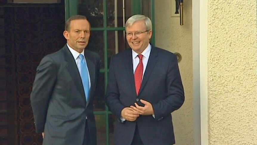 Tony Abbott and Kevin Rudd share an awkward moment