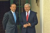 Tony Abbott and Kevin Rudd share an awkward moment