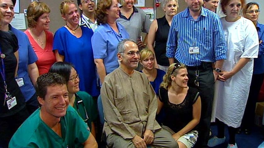 East Timor's President Jose Ramos-Horta, centre, sits with staff at Royal Darwin Hospital