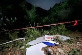 White debris from a plane is seen at the crash site. 
