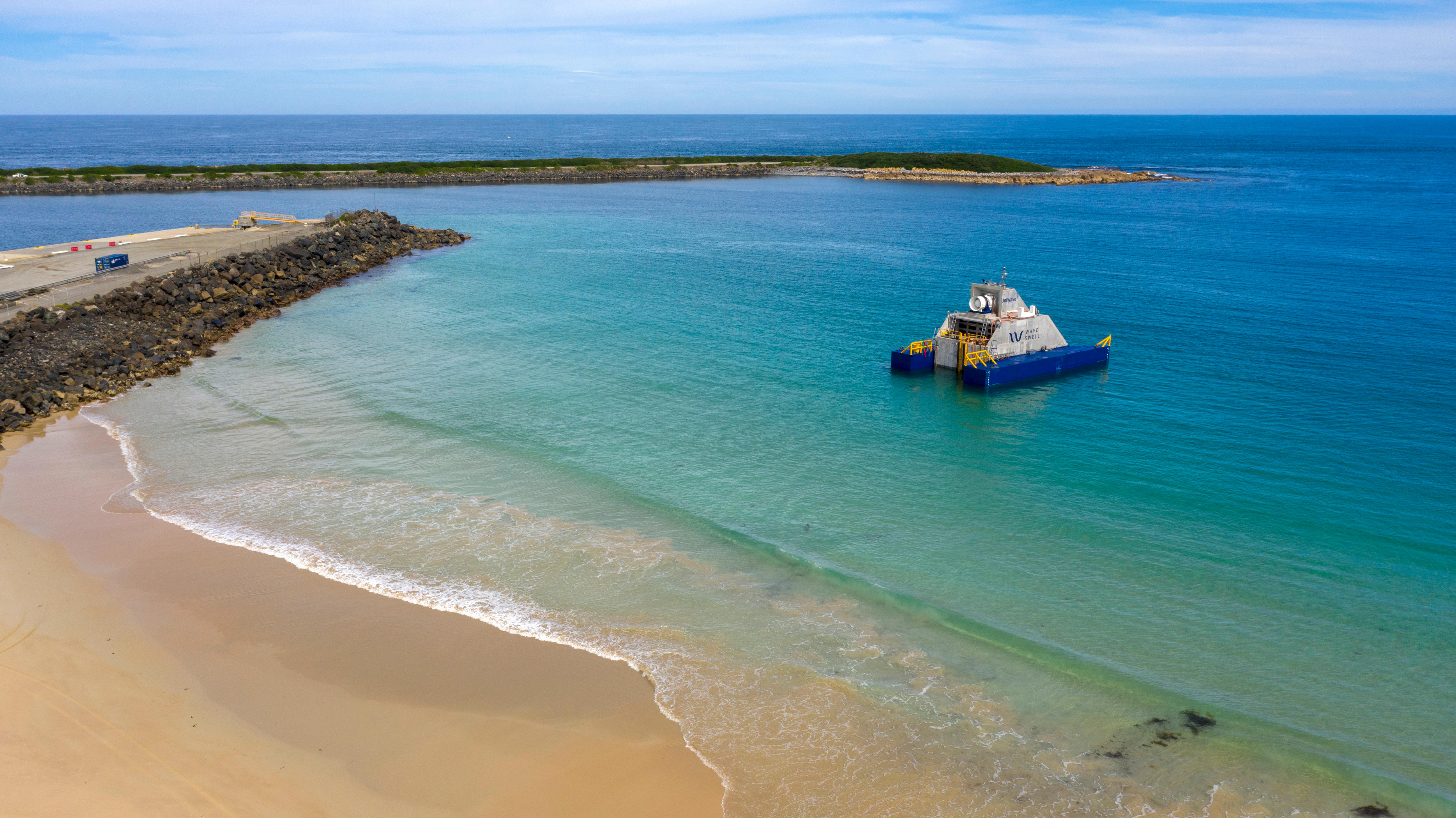 A floating platform in shallow water off a beach.