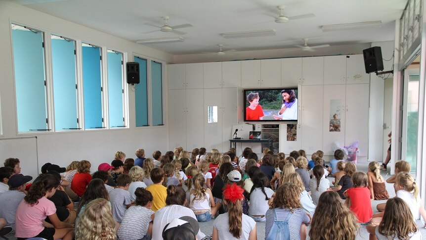 Arlian's film 'Plastic Alarm' is screened at a school assembly.