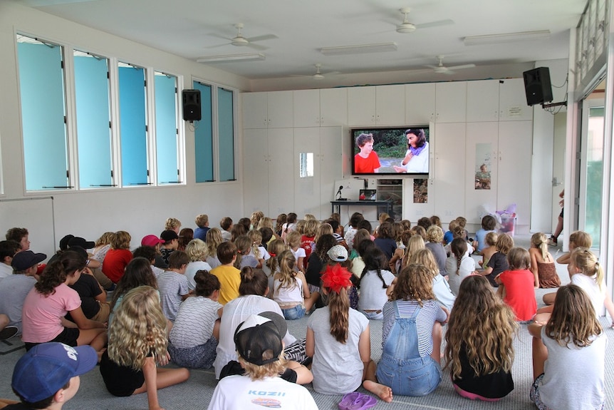 Arlian's film 'Plastic Alarm' is screened at a school assembly.