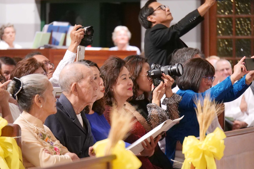 Picture of family members sat in the pews.