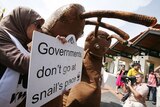 Activists protest outside climate change talks