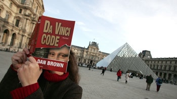 A fan of The Da Vinci Code, outside the Louvre. (File photo)