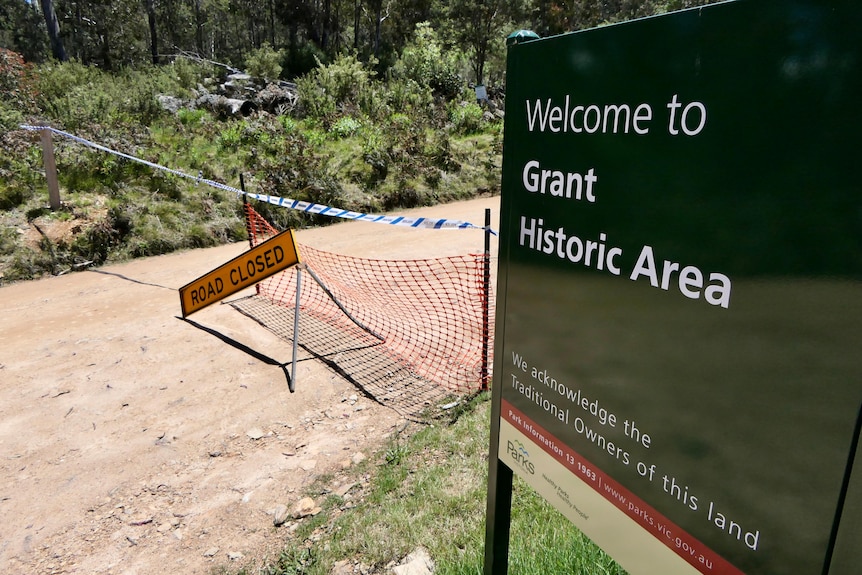 Sign of grant in front of police block.