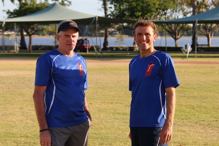 On My Feet founder Keegan Crage stands with Ian in a Perth park.