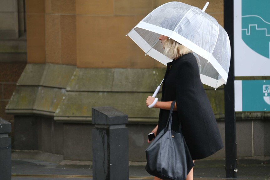 Umbrellas make a general appearance in Hobart mid-summer