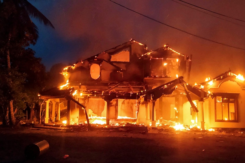 A house is engulfed in flames