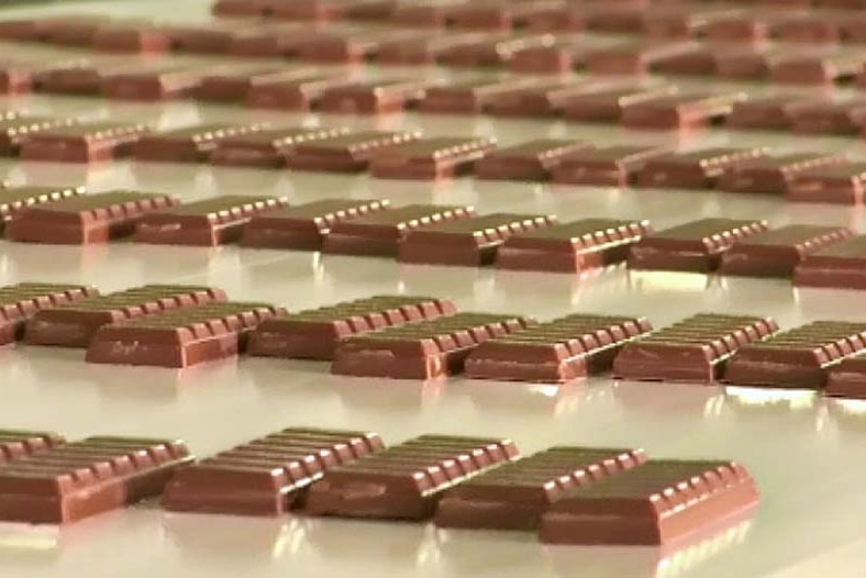 Blocks of Cadbury chocolate on a conveyor belt at its Tasmanian factory.