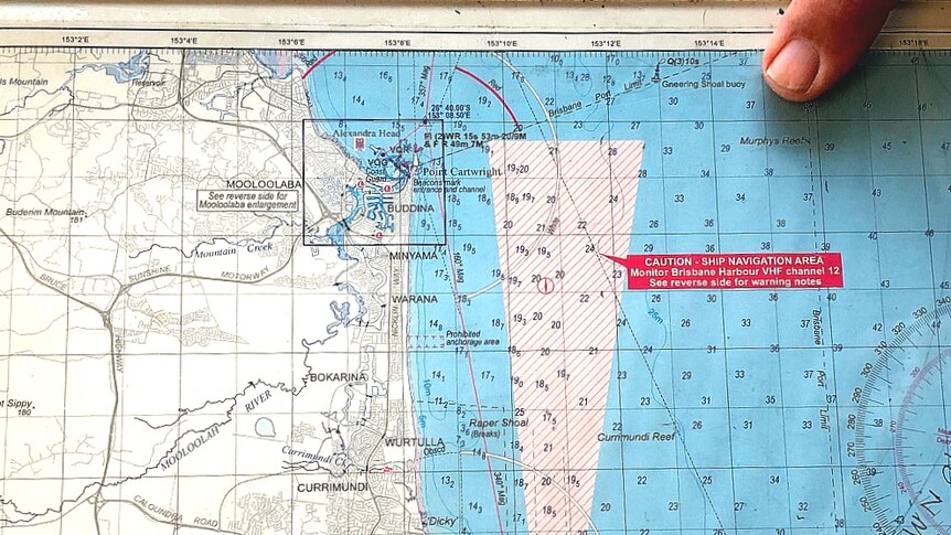 Maritime map showing the shipping channel to Brisbane and a finger pointing at Murphy's Reef