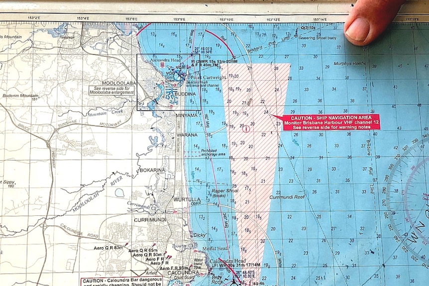 Maritime map showing the shipping channel to brisbane and a finger pointing at Murphy's Reef