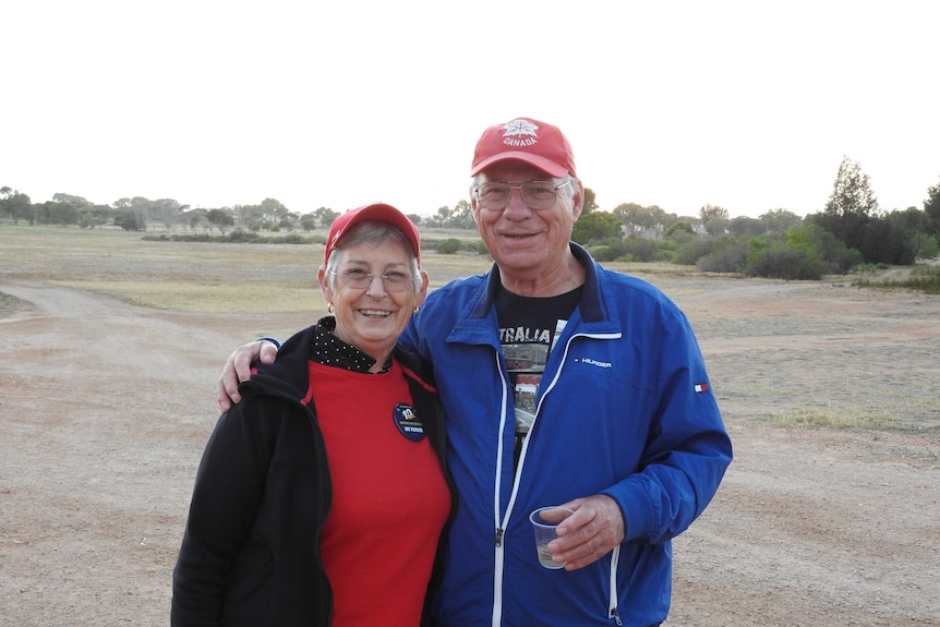 Husband and wife couple on golf course on the Nullarbor