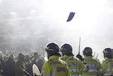 Birmingham City fans face up to police after storming the pitch following the team's 2-1 win.